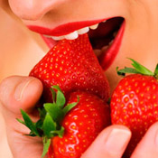 Woman having strawberries for a snack