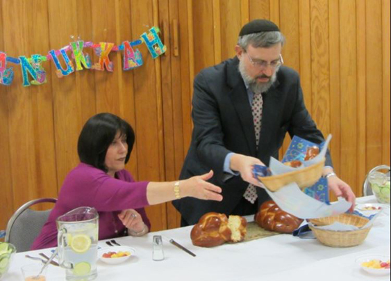 Rebbetzin serving challah