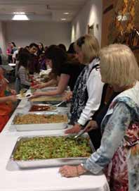 Woman serving food at a Congregation Beth Israel event in Omaha, Nebraska
