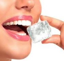 A woman chewing ice which is a very bad habit for your teeth